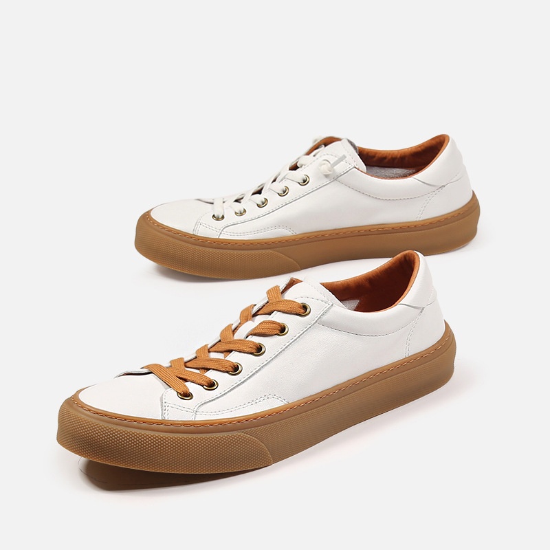 Baskets basses décontractées en cuir véritable blanc respirant, style européen, fabriquées à la main à Guangzhou. Chaussures de skate blanches, respirantes et confortables._voghion.com