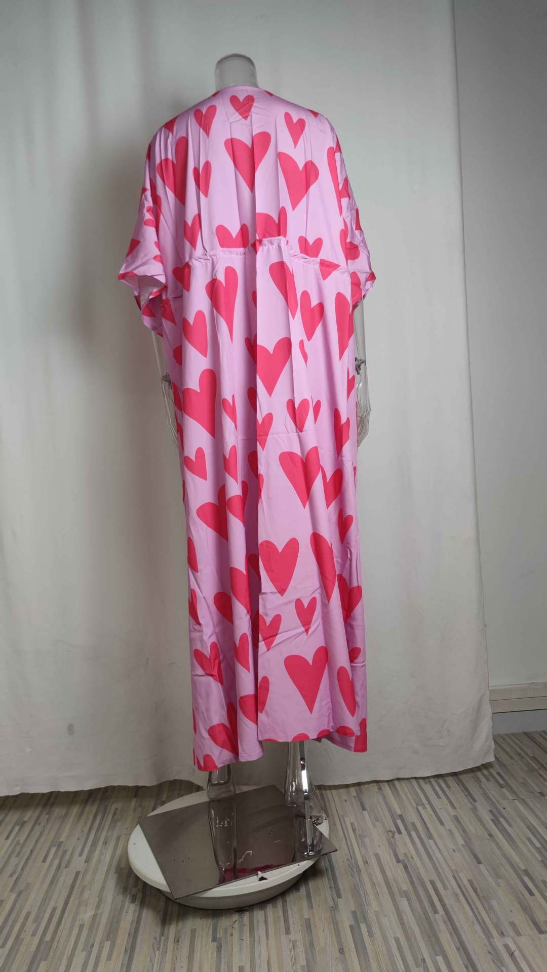 Dames maxi jurk met v-hals print en wijde zoom_voghion.com