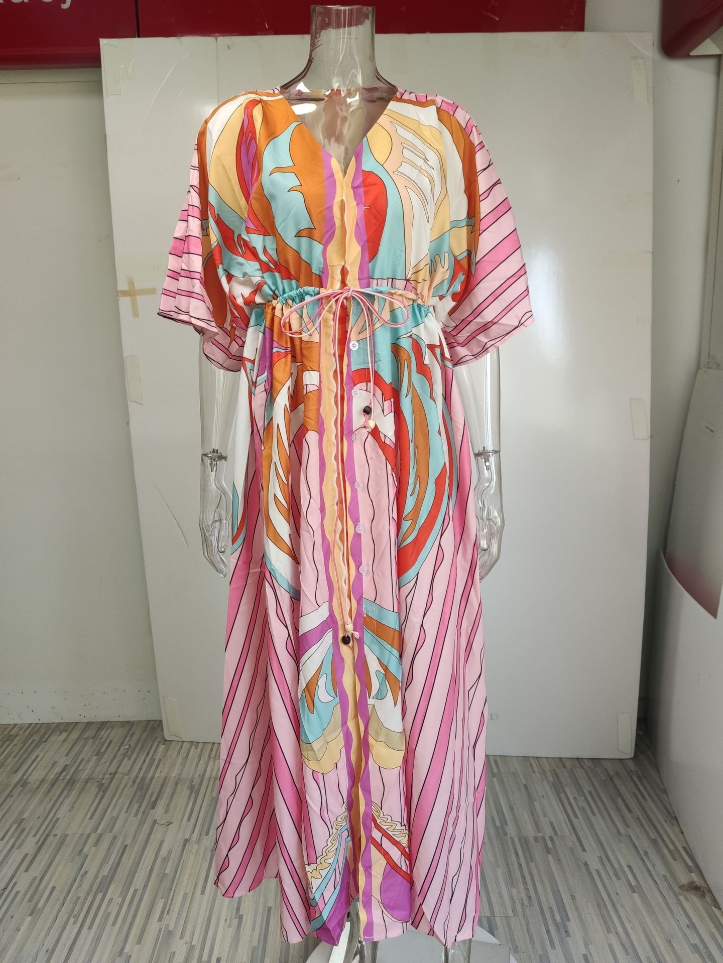 Dames maxi jurk met v-hals print en wijde zoom_voghion.com